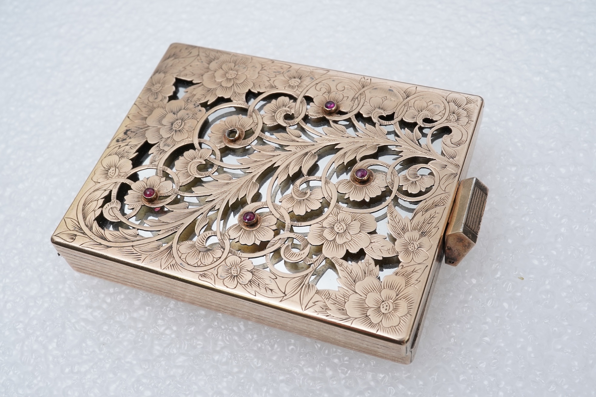 Boucheron, a silver gilt and ruby vanity case, France, 1940s